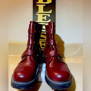OS-women’s boot. Burgundy man made leather high boot with silver buckle. Used 2x